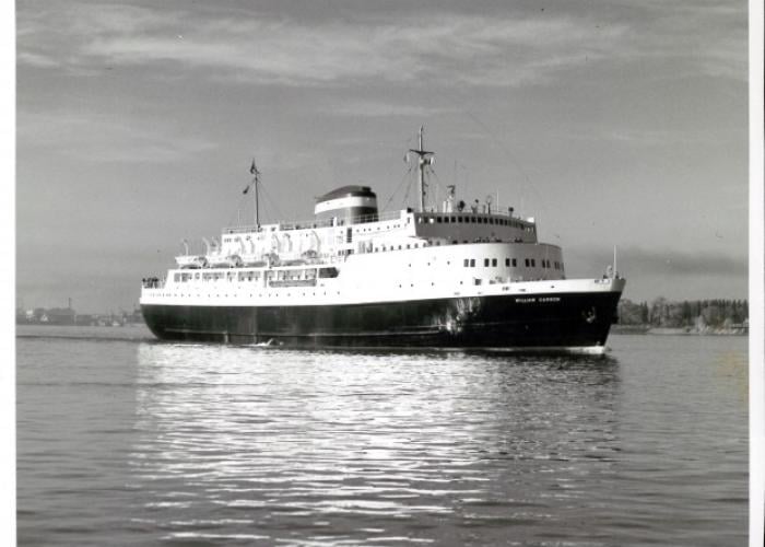 Side shot of the William Carson sailing away from the port