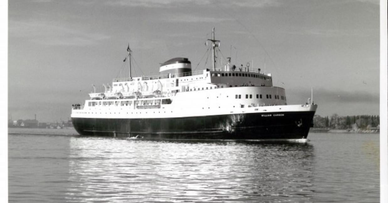 Side shot of the William Carson sailing away from the port